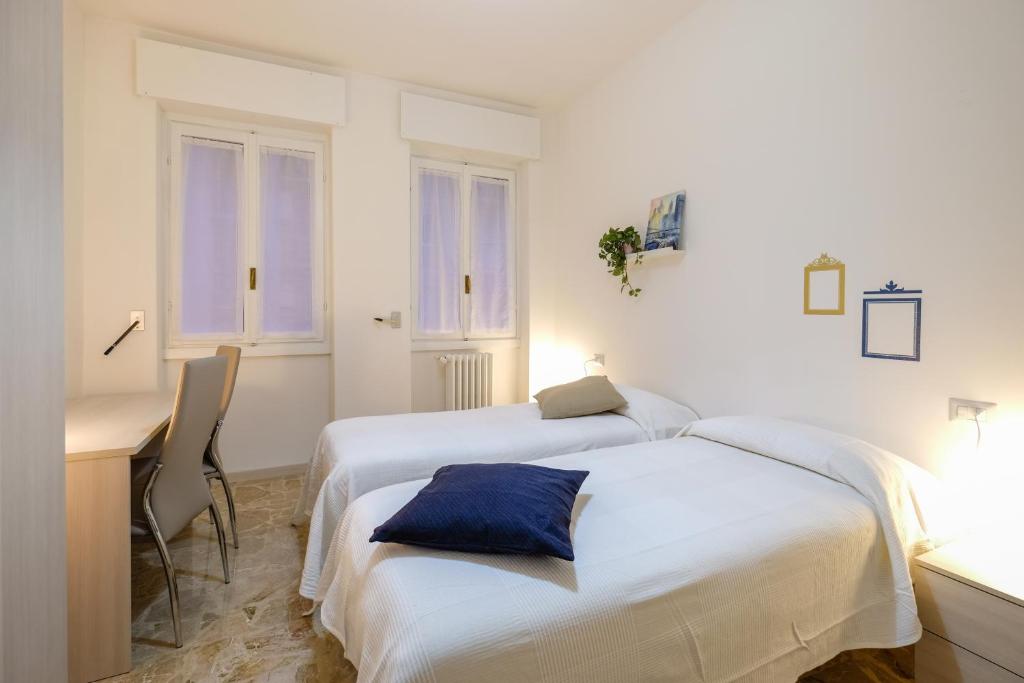 Llit o llits en una habitació de The Best Rent - Ripamonti Apartment