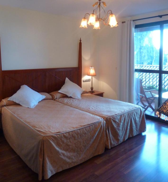 Postel nebo postele na pokoji v ubytování Hotel Sierra de Cazorla & SPA 3*