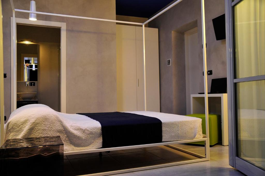 Postel nebo postele na pokoji v ubytování Ai Lecci in Centro