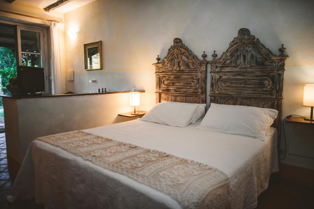 A bed or beds in a room at Fattoria Di Corsignano