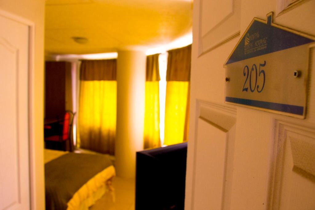 Postel nebo postele na pokoji v ubytování Hostal Quinta Normal