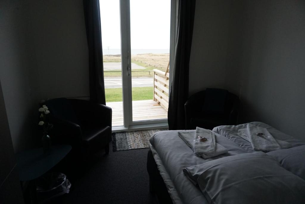 Postel nebo postele na pokoji v ubytování B&B by the Sea Hirtshals