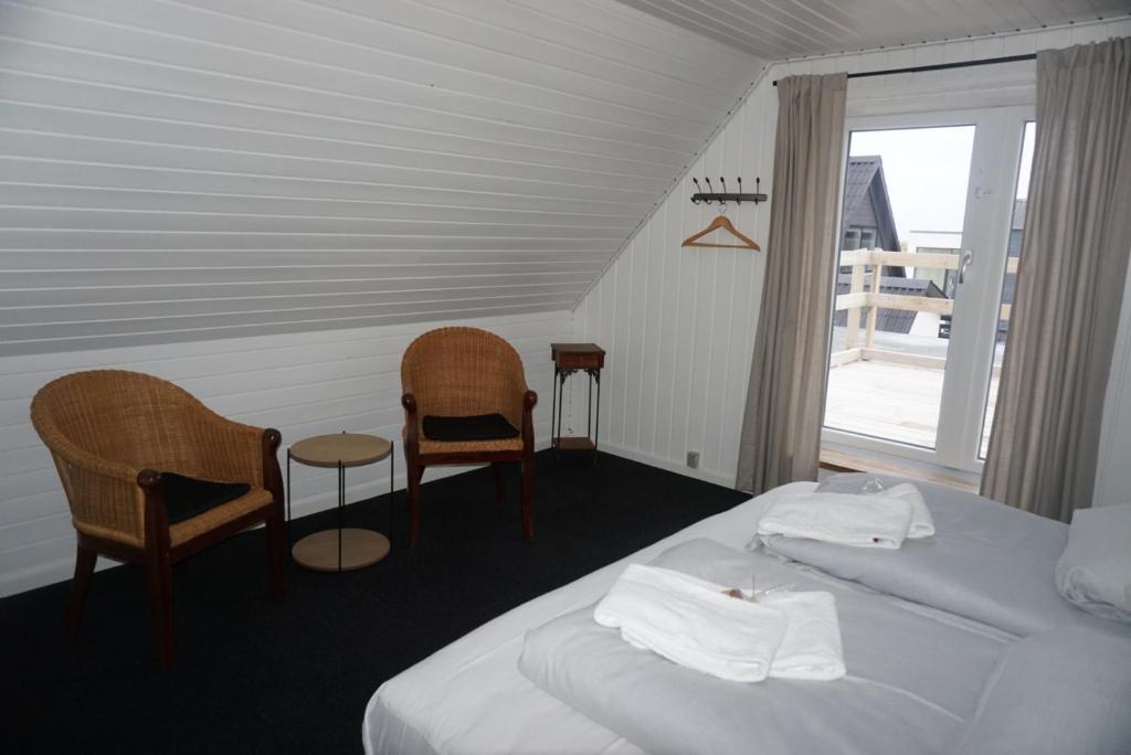 Postel nebo postele na pokoji v ubytování B&B by the Sea Hirtshals