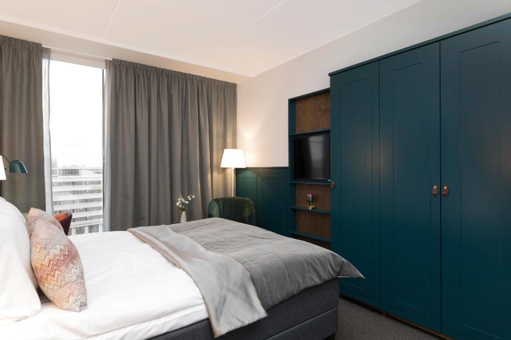 Postel nebo postele na pokoji v ubytování Elite Hotel Carolina Tower