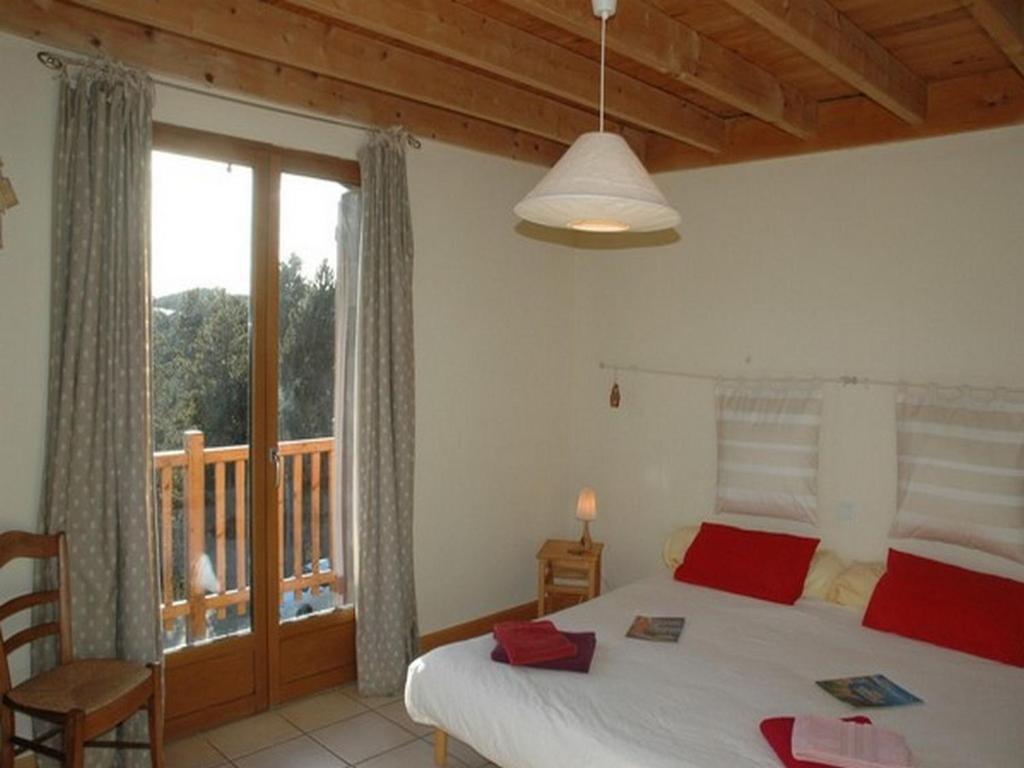 Postel nebo postele na pokoji v ubytování Chalet l'Angélique