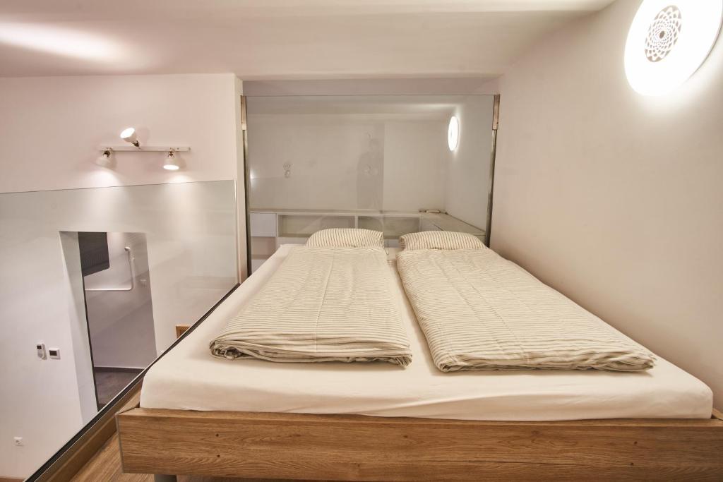 Posteľ alebo postele v izbe v ubytovaní V27 Apartment | hostAID