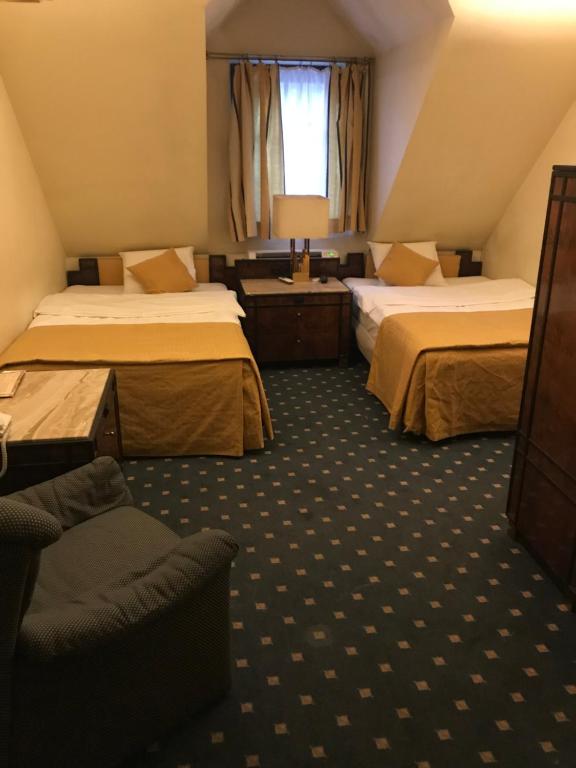 Postel nebo postele na pokoji v ubytování Hotel Podzamcze
