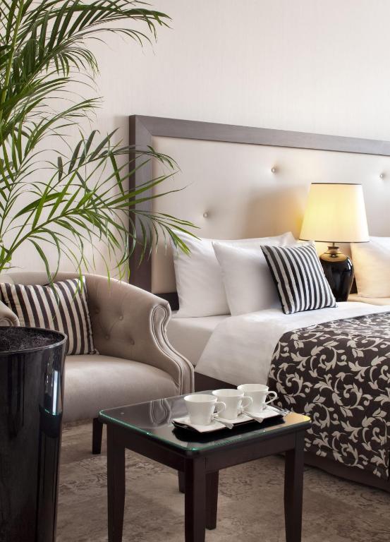 Posteľ alebo postele v izbe v ubytovaní Metropolitan Boutique Hotel