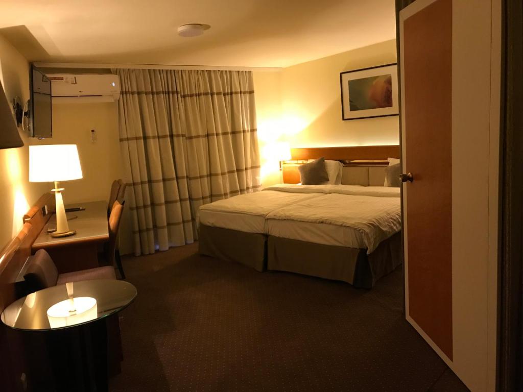Postel nebo postele na pokoji v ubytování Hotel Podzamcze
