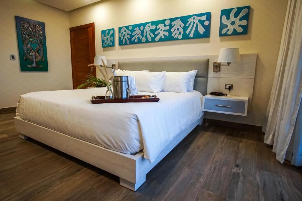 Postel nebo postele na pokoji v ubytování Satama Hotel