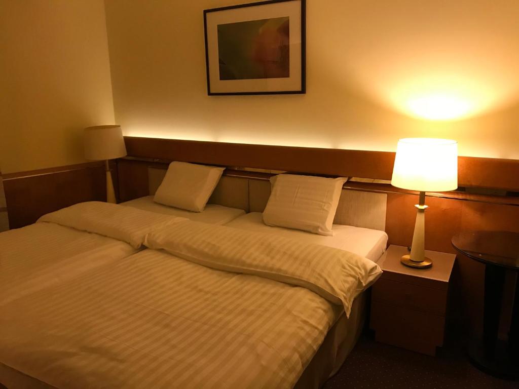 Postel nebo postele na pokoji v ubytování Hotel Podzamcze