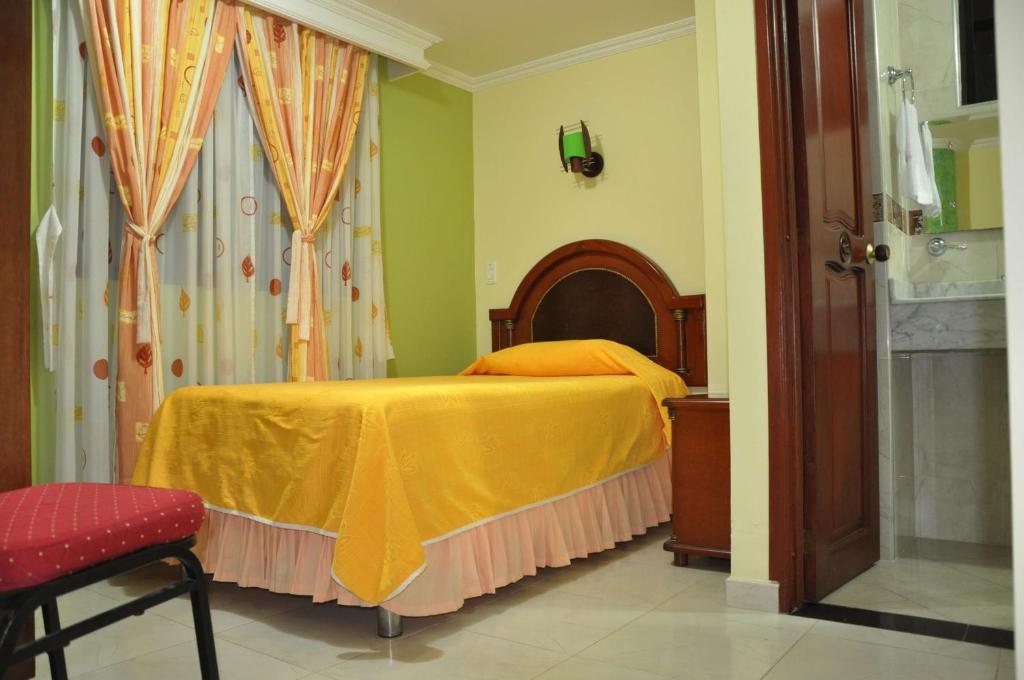 Postel nebo postele na pokoji v ubytování Hotel el Caimito