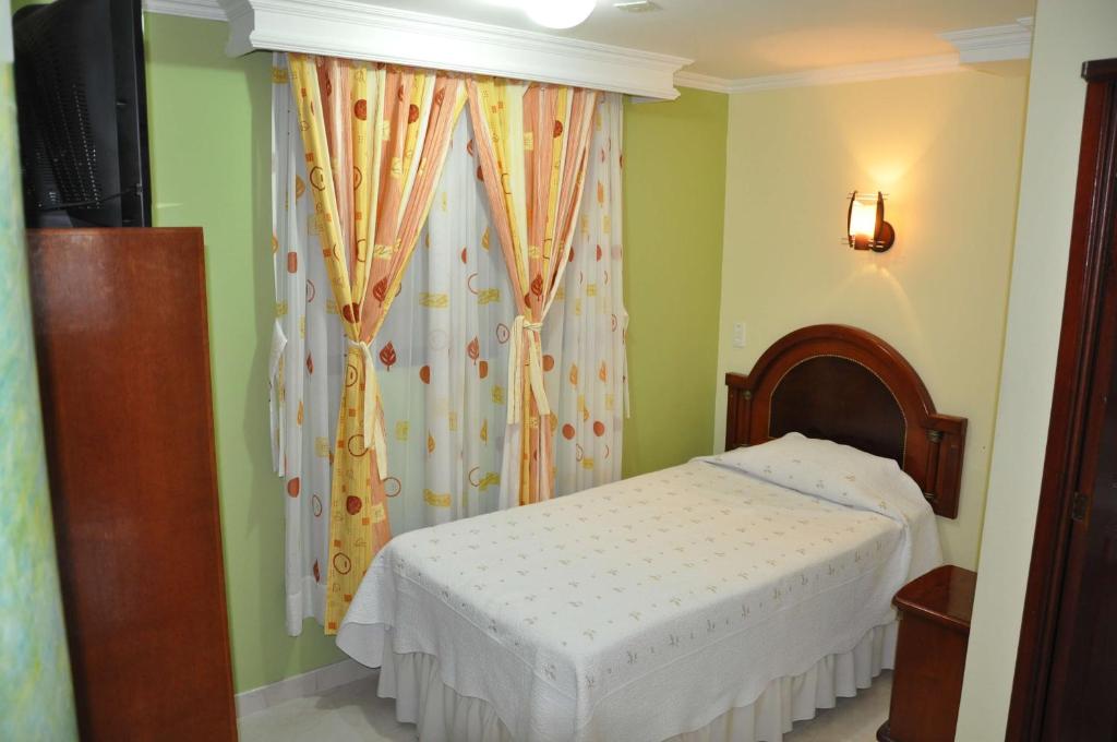 Postel nebo postele na pokoji v ubytování Hotel el Caimito