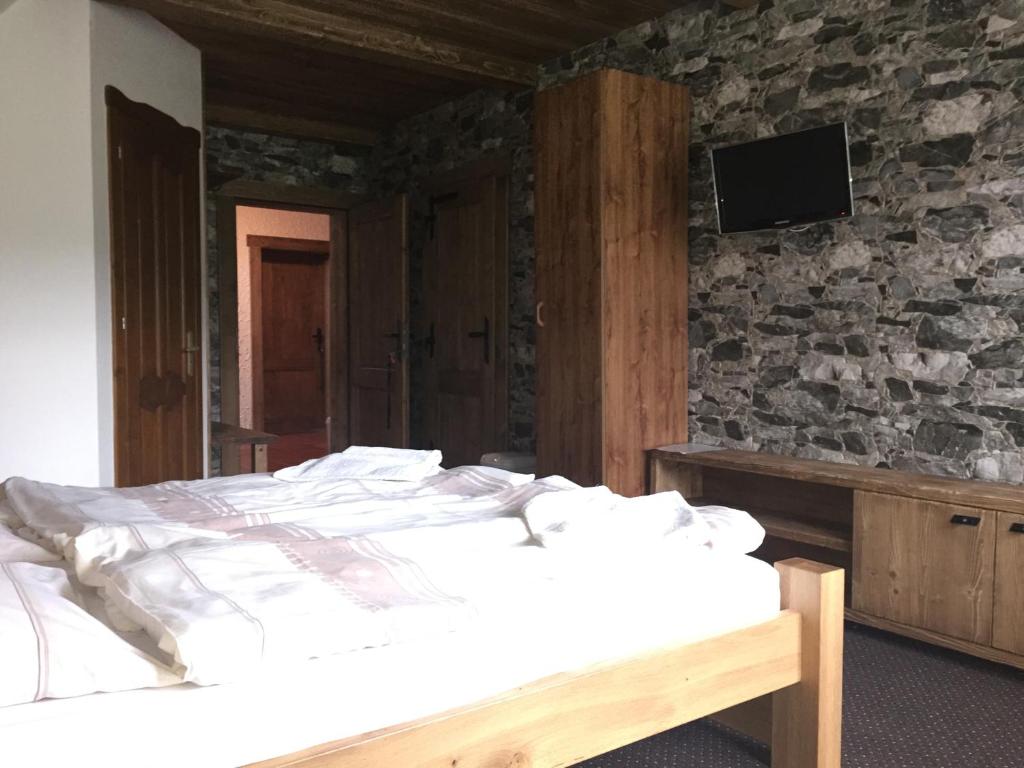 Postel nebo postele na pokoji v ubytování Penzion Slovakia