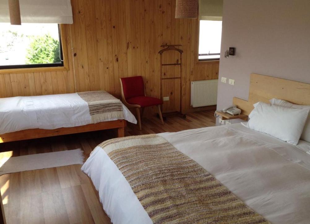 Postel nebo postele na pokoji v ubytování Hotel Ilaia