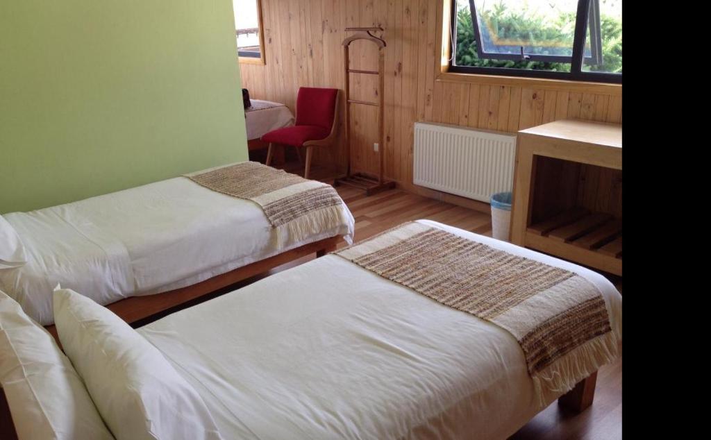 Postel nebo postele na pokoji v ubytování Hotel Ilaia