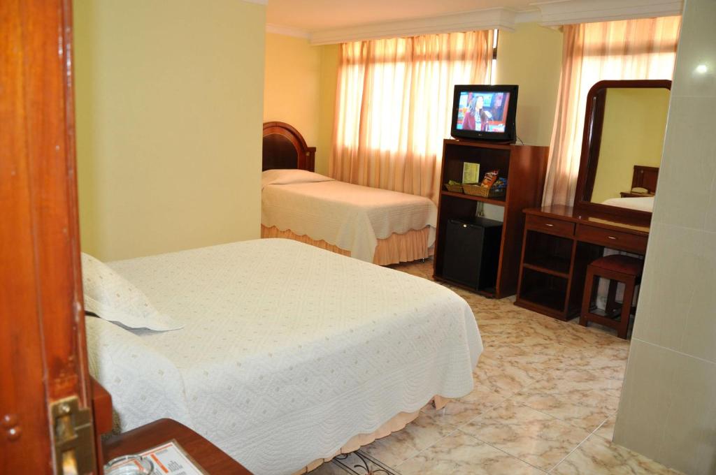 Postel nebo postele na pokoji v ubytování Hotel el Caimito