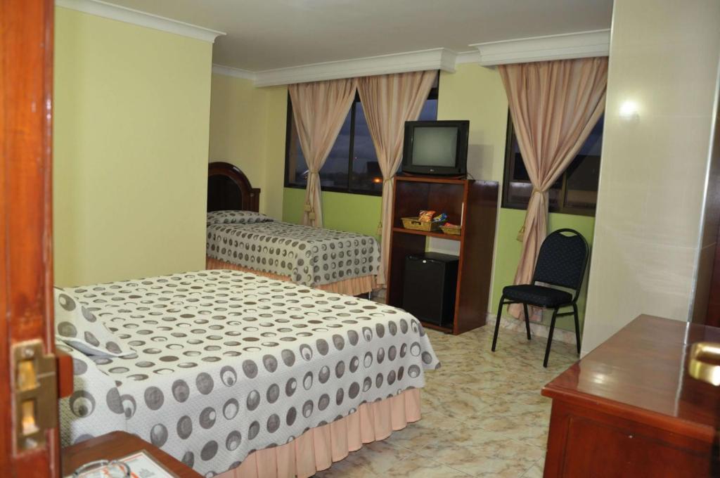 Postel nebo postele na pokoji v ubytování Hotel el Caimito