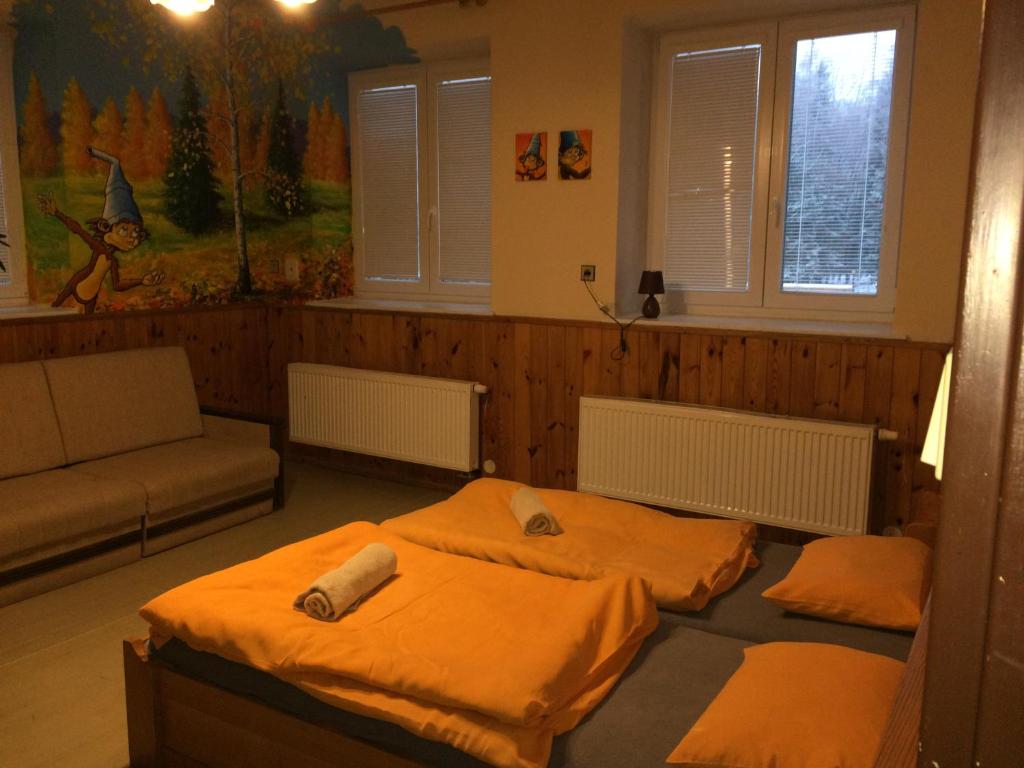 Postel nebo postele na pokoji v ubytování Chata Orlí vrch
