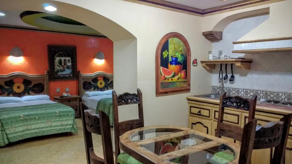 Postel nebo postele na pokoji v ubytování Suites Flamboyanes