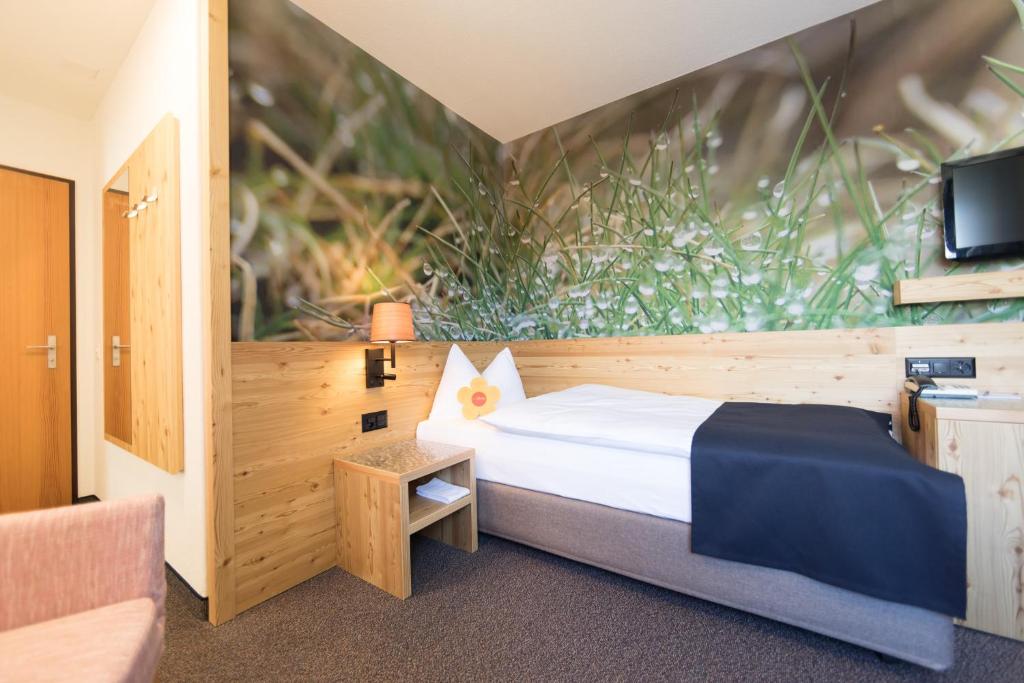 Postel nebo postele na pokoji v ubytování Hotel Garni Chesa Mulin