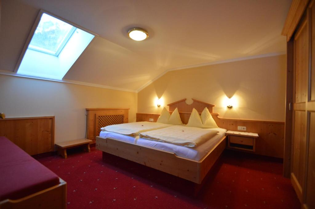 Postel nebo postele na pokoji v ubytování Apartments & Zimmer Urschnerhof