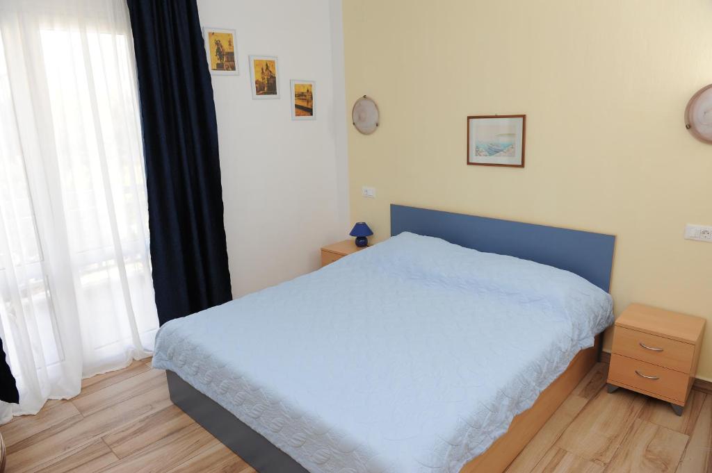 Postel nebo postele na pokoji v ubytování Apartments Lončar