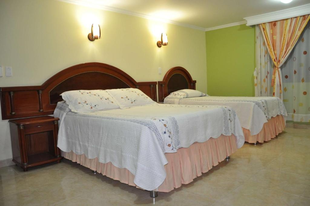 Postel nebo postele na pokoji v ubytování Hotel el Caimito