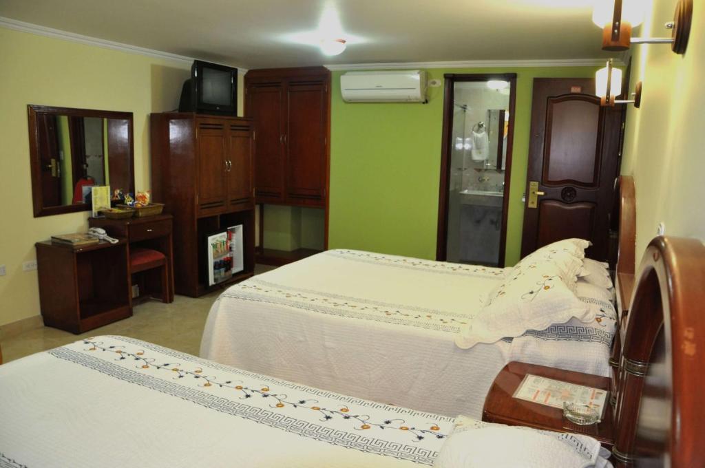 Postel nebo postele na pokoji v ubytování Hotel el Caimito