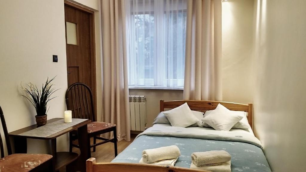 Postel nebo postele na pokoji v ubytování Pod Jarzębiną