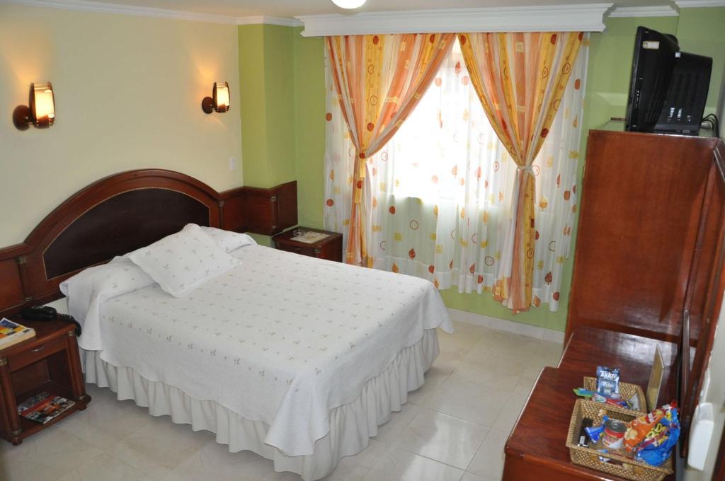 Postel nebo postele na pokoji v ubytování Hotel el Caimito