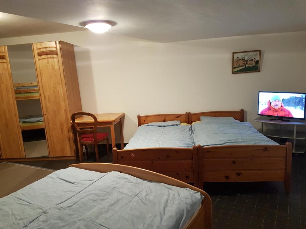 Postel nebo postele na pokoji v ubytování Holidays Groupes Anzère