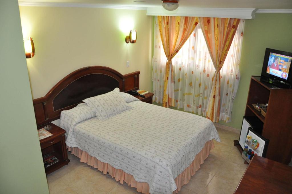 Postel nebo postele na pokoji v ubytování Hotel el Caimito