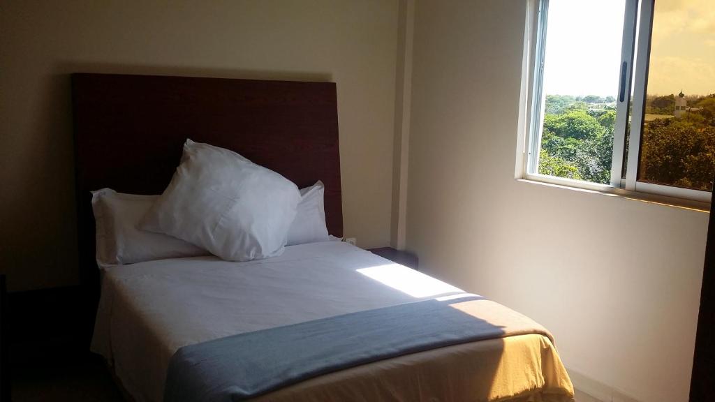 Postel nebo postele na pokoji v ubytování Ponta View Hotel