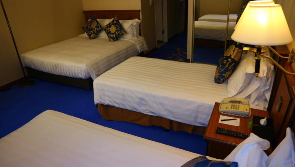 Voodi või voodid majutusasutuse The Kimberley Hotel toas