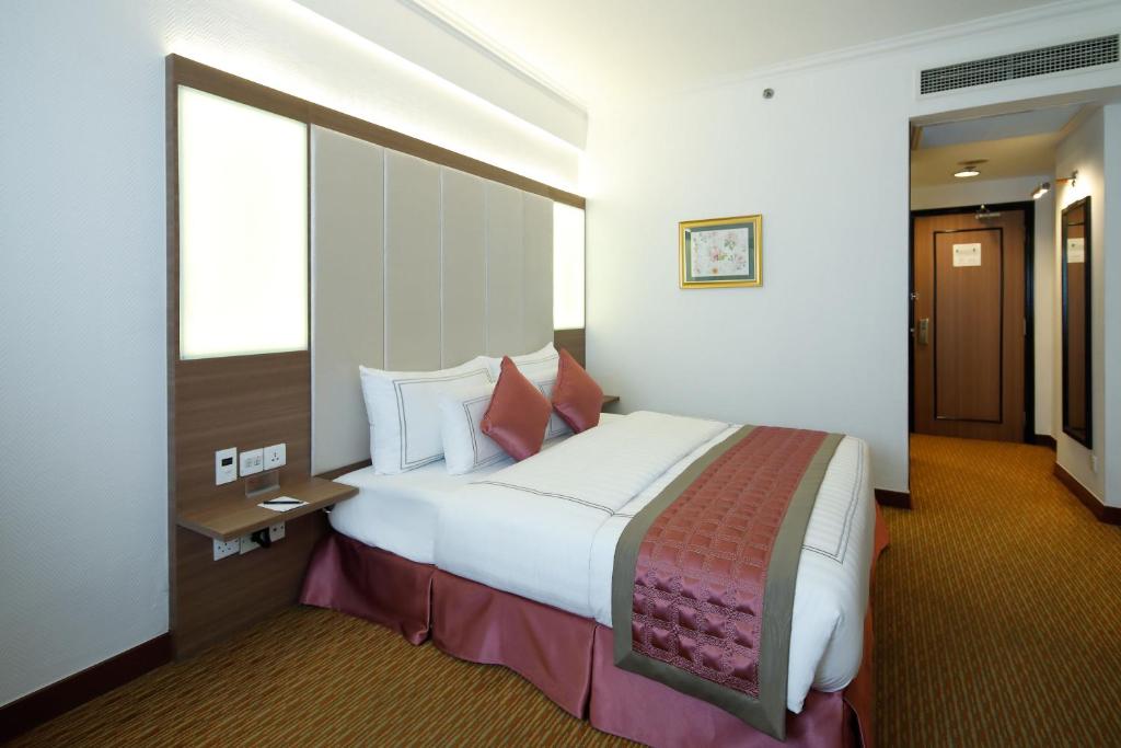 Postel nebo postele na pokoji v ubytování Sunway Hotel Hanoi