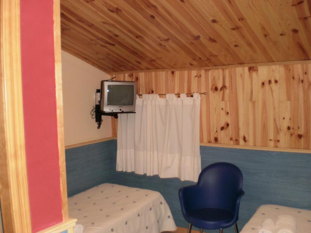 TV a/nebo společenská místnost v ubytování Hostal El Cartero