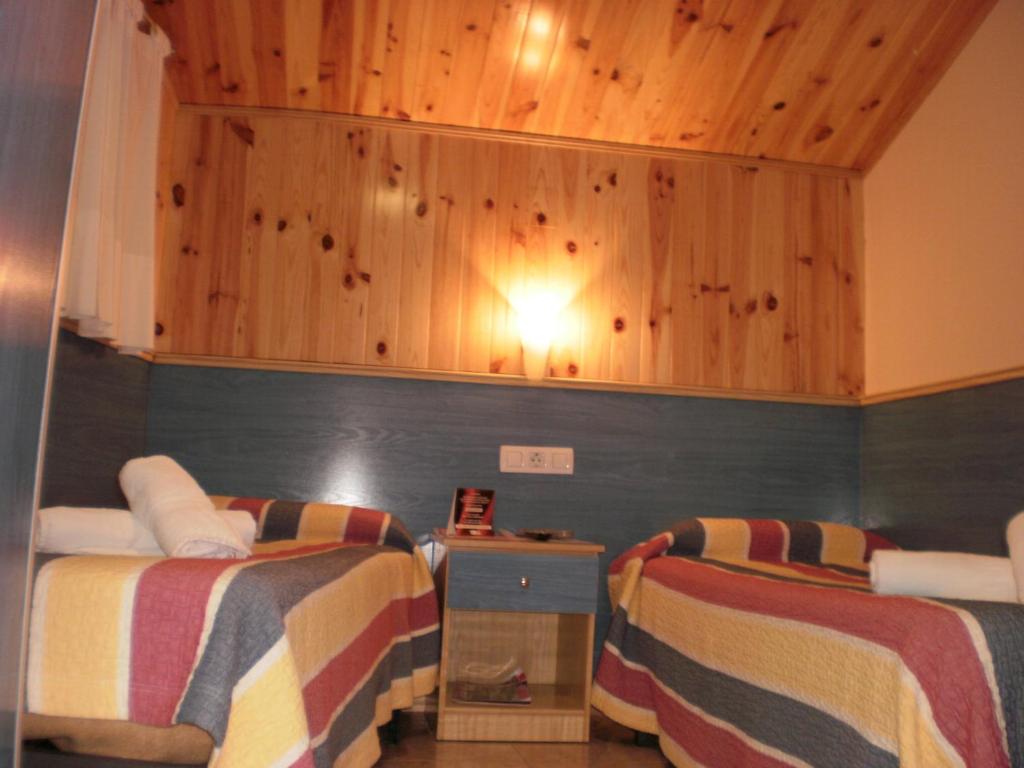 Postel nebo postele na pokoji v ubytování Hostal El Cartero