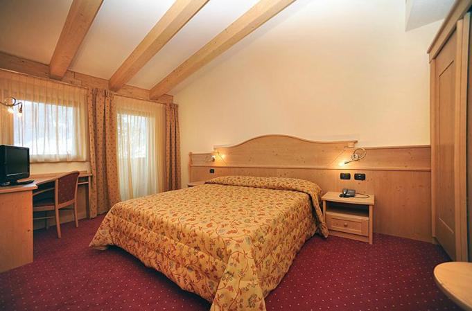 Postel nebo postele na pokoji v ubytování Hotel Europa