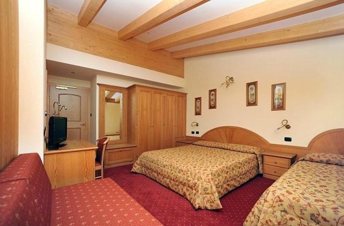 Postel nebo postele na pokoji v ubytování Hotel Europa