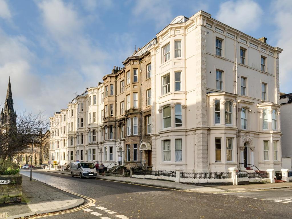 a row of white buildings on a city street at The Spires in Scarborough