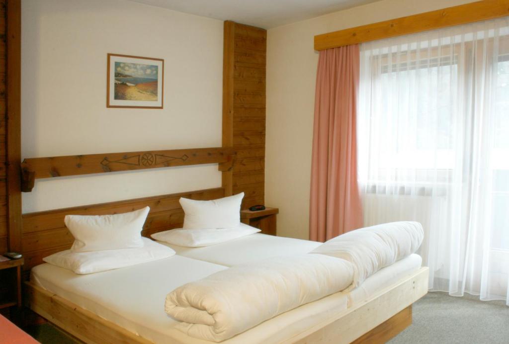 Postel nebo postele na pokoji v ubytování Pension Ötztalerhof