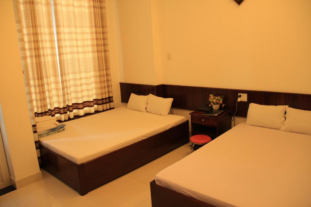 Postel nebo postele na pokoji v ubytování Mai Guest House
