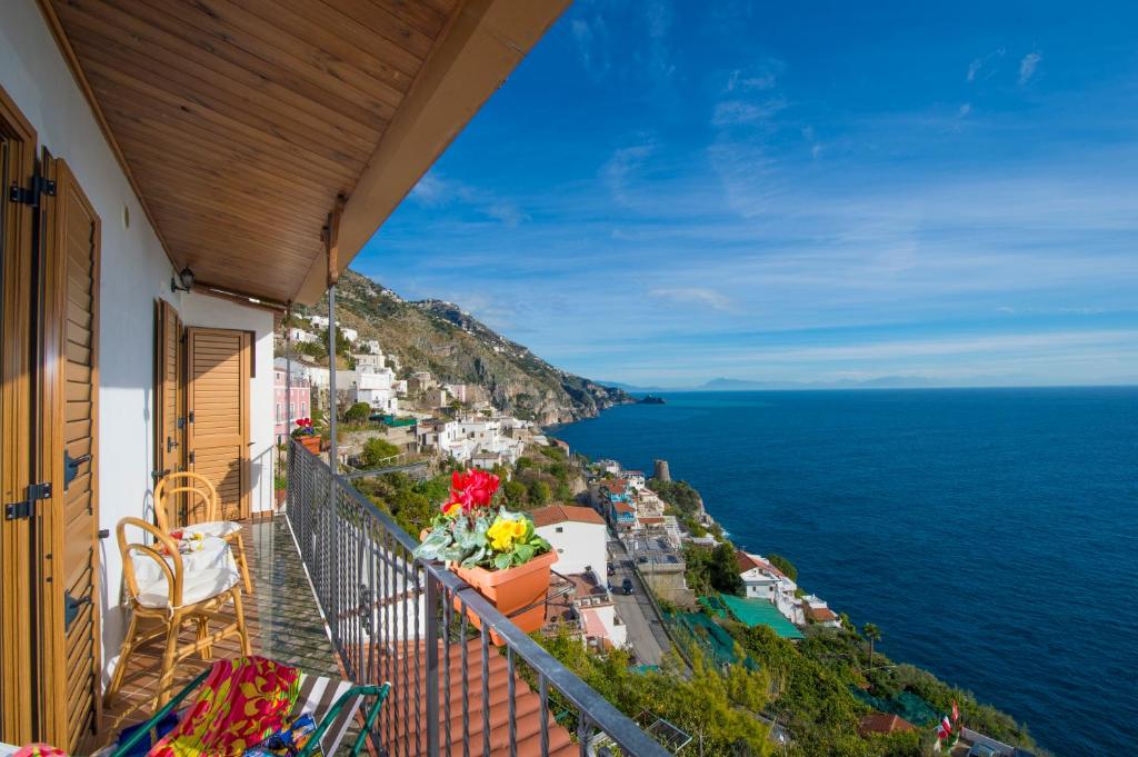 a balcony of a building with a view of the ocean at Casa I Girasoli in Praiano