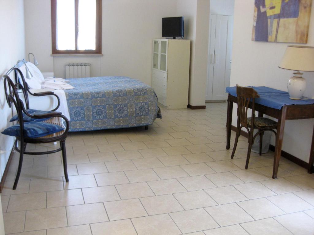Posteľ alebo postele v izbe v ubytovaní Country House-B&B-Appartamenti Ai Cipressi