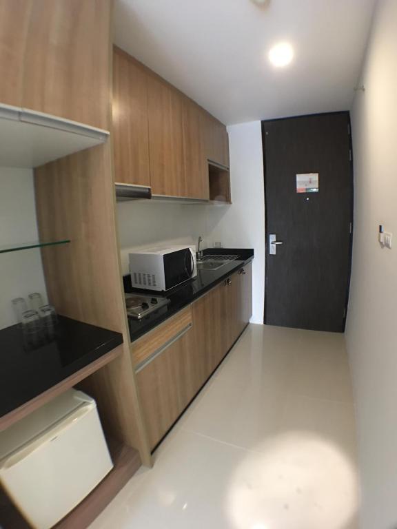 Kuchyň nebo kuchyňský kout v ubytování Mida de Sea Residence Hua Hin