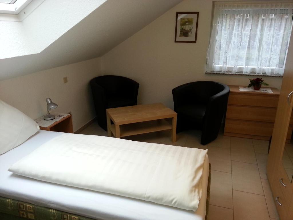 Postel nebo postele na pokoji v ubytování Hotel Am Kamin