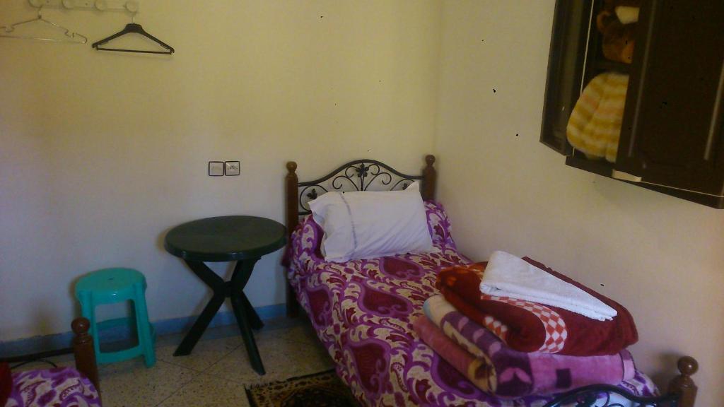 Postel nebo postele na pokoji v ubytování Hotel Imilchil