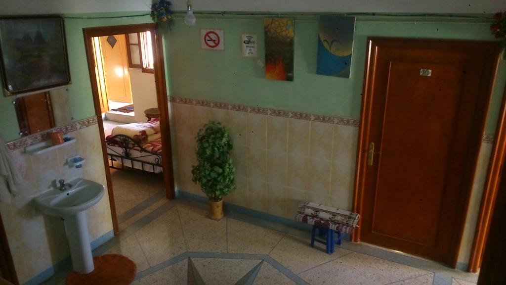 Postel nebo postele na pokoji v ubytování Hotel Imilchil