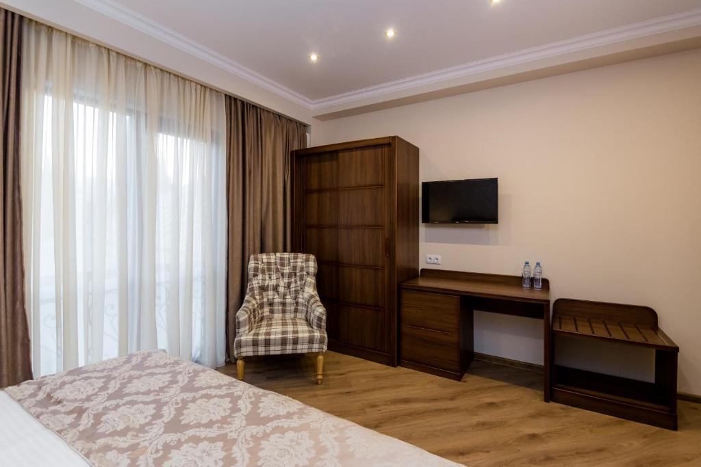 Postel nebo postele na pokoji v ubytování Orchid Boutique Hotel